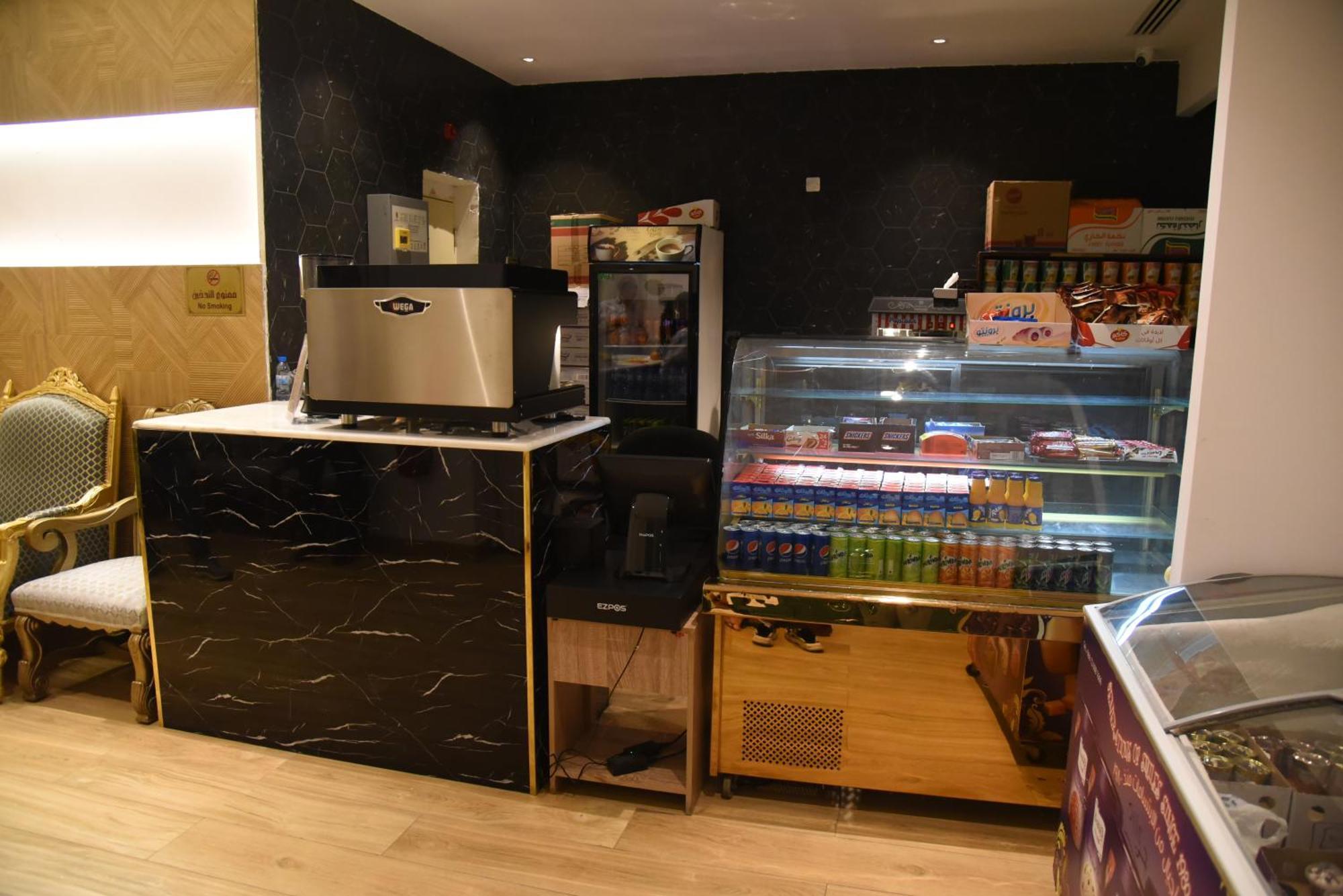 Roya Al Andalus Hotel Medina Exterior foto A coffee machine in a hotel